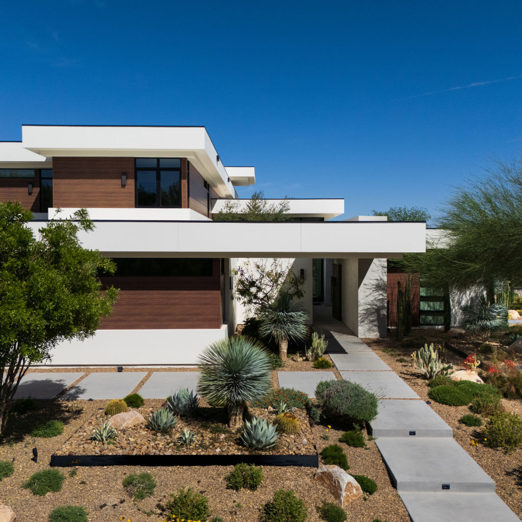 Emberlyn Estate — modern two-story custom home in Las Vegas by Kingdom & Co., front entry and desert courtyard view