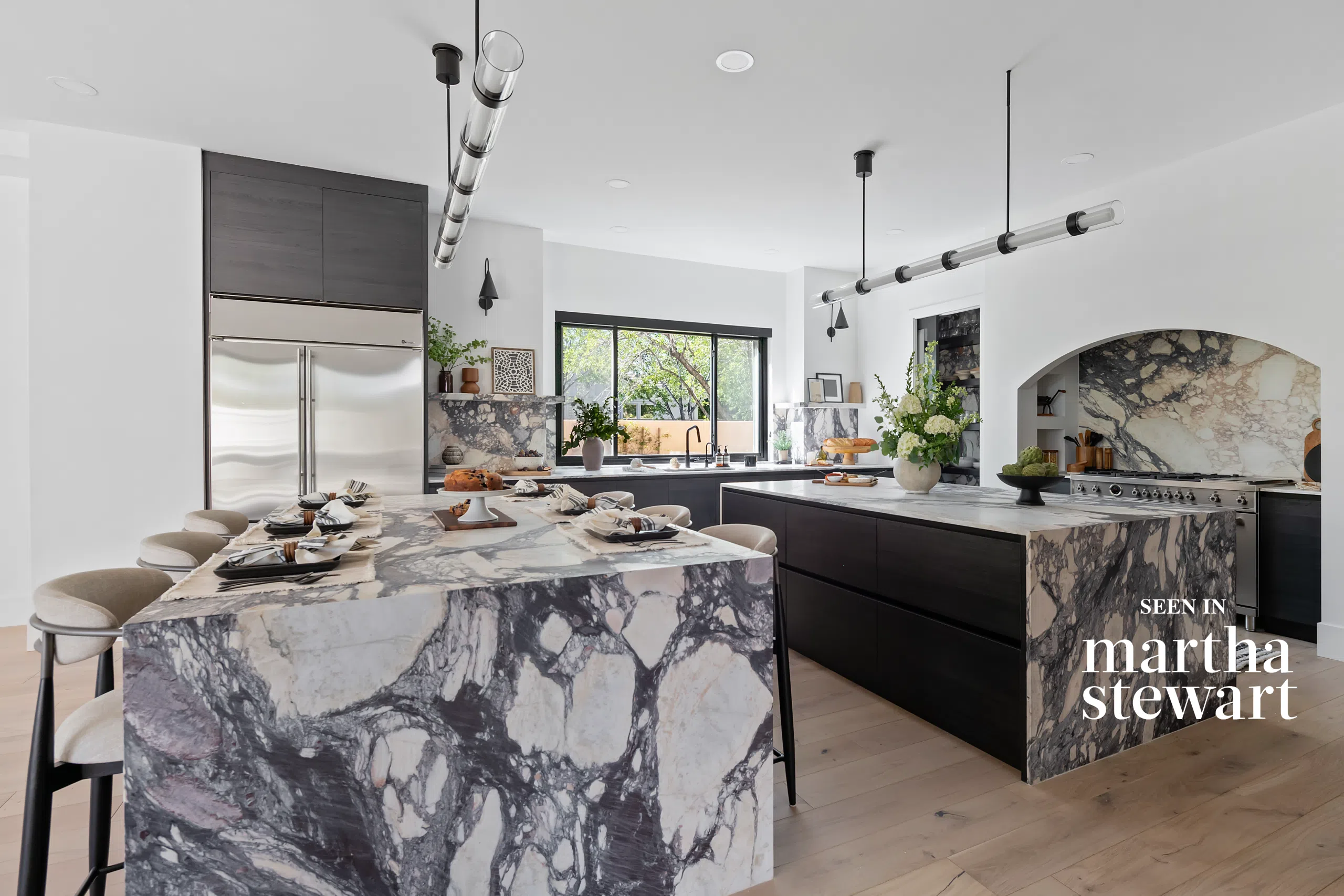 The Viola luxury kitchen remodel in Summerlin Las Vegas by Kingdom & Co. with marble island and custom dark cabinetry