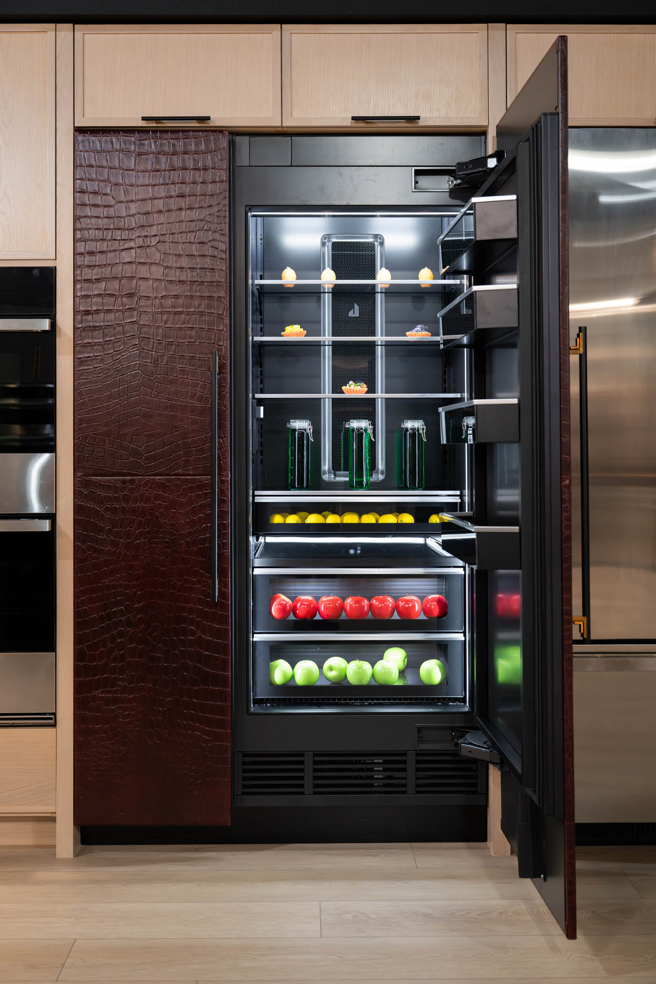 FergusonShowroom_CommercialRemodel_Kingdomandco Modern fridge filled with colorful produce
