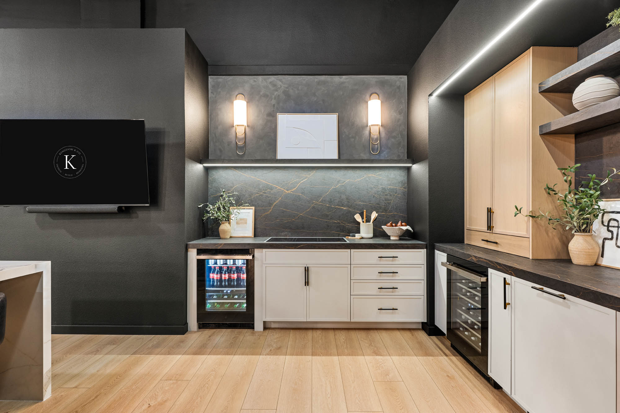 Luxury kitchen featuring wall ovens, marble backsplash, and pendant lighting designed by Kingdom & Co Las Vegas.