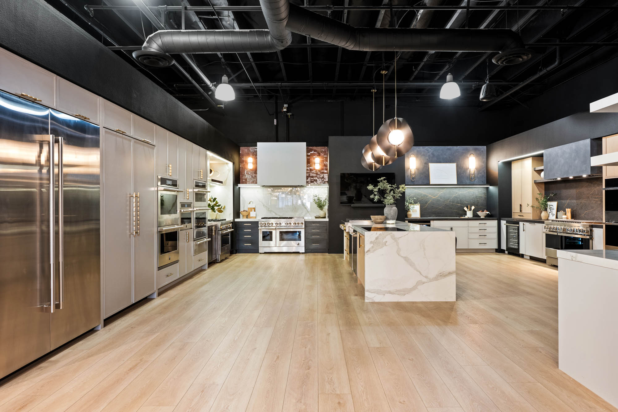 Expansive modern kitchen with marble island and integrated lighting designed by Kingdom & Co Las Vegas.