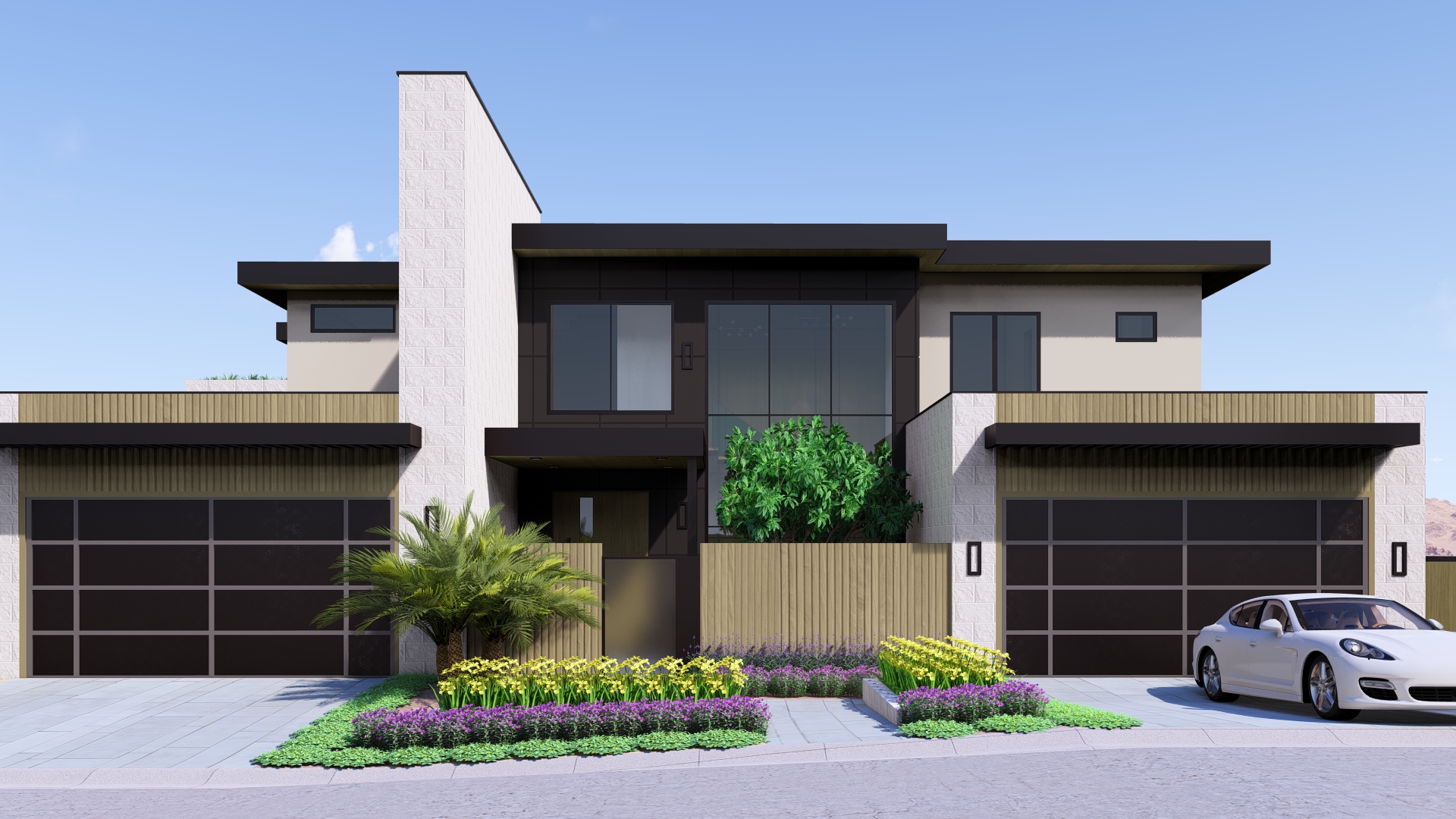 Front Elevation of Ascaya Luxury Home | Kingdom & Co. Architecture Full front elevation of a modern luxury home in Ascaya featuring glass, stone textures, wood details, and lush desert landscaping.