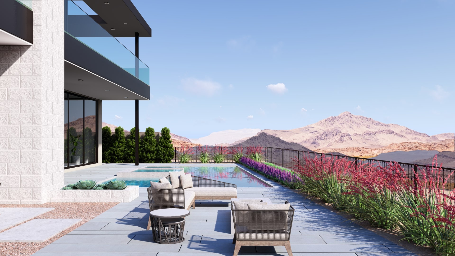 Poolside seating overlooking desert mountains at a modern MacDonald Highlands luxury home built by Kingdom & Co