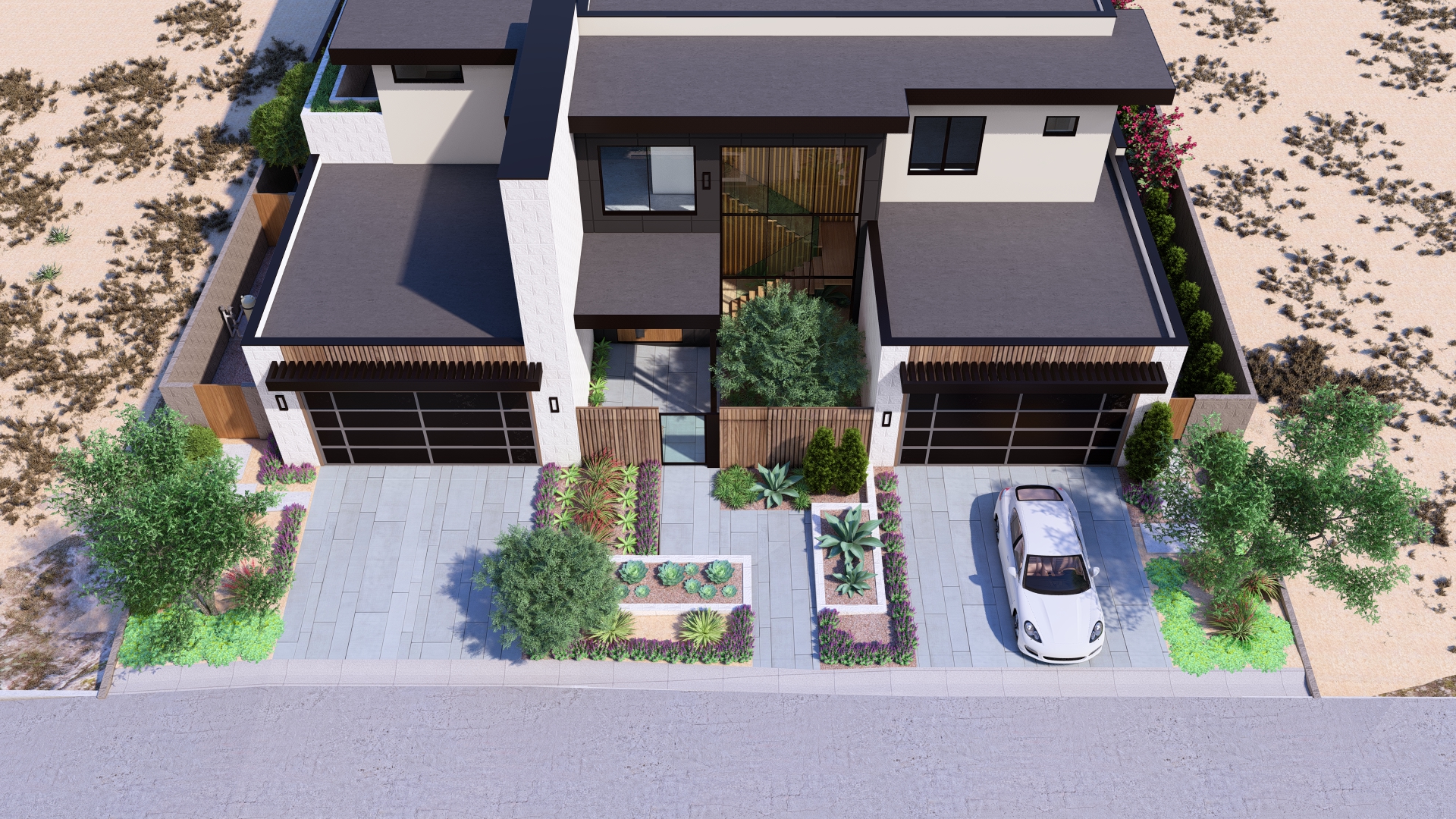 Aerial view of the backyard at Kingdom & Co.’s Ascaya home, featuring a modern pool, fire pit, outdoor lounge areas, and desert landscaping.