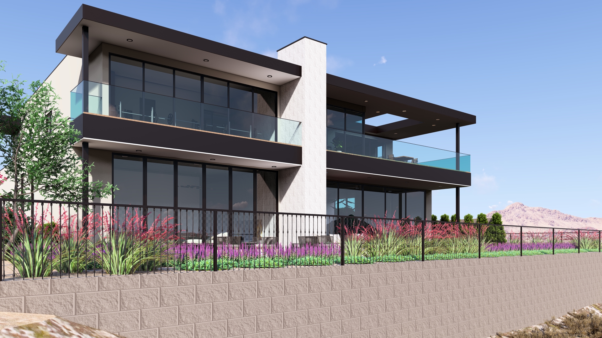 Rear exterior view of a modern Ascaya home with glass balconies, expansive windows, and layered architectural forms.