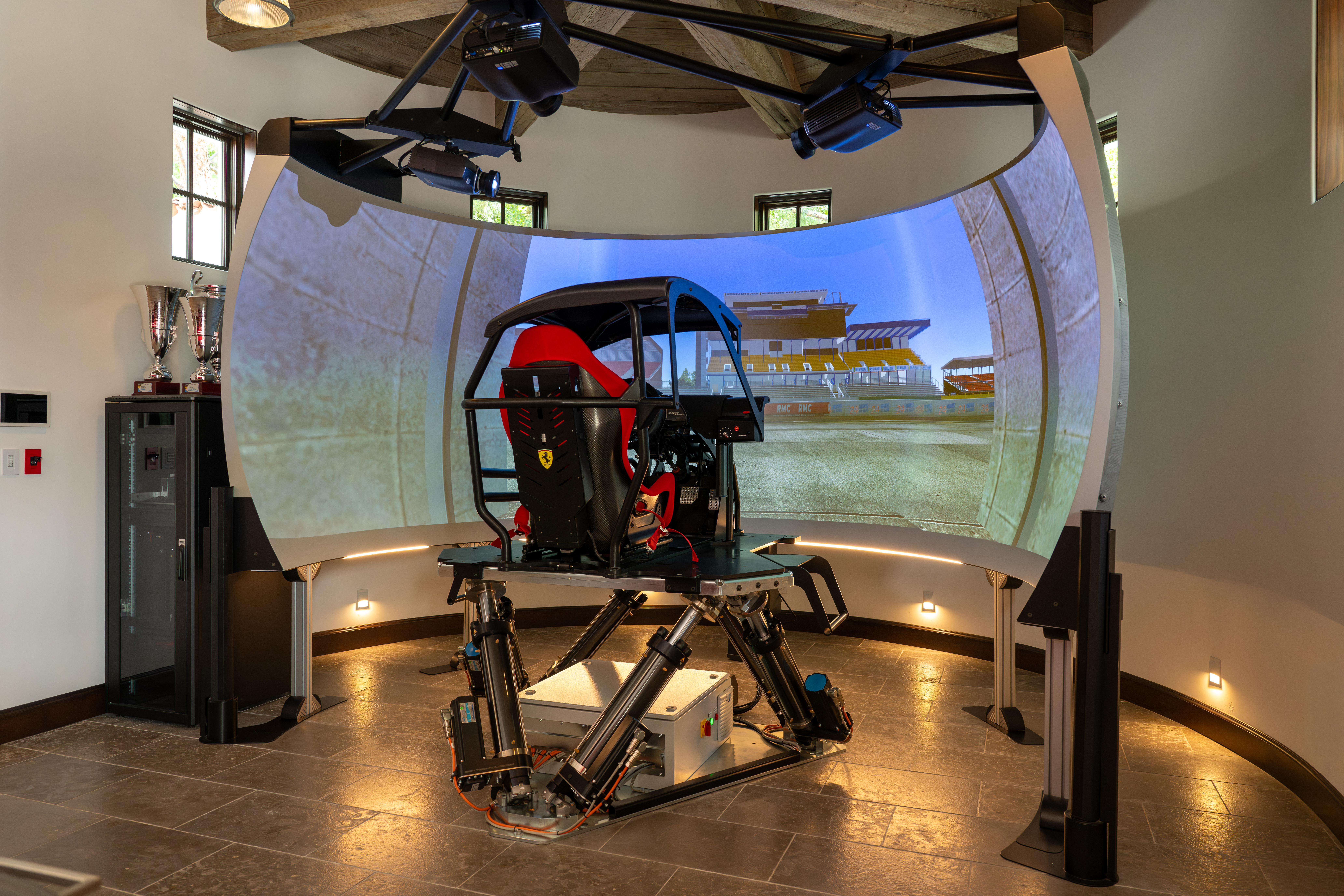 Ferrari F1 racing simulator room inside Santa Barbara Estate in Southern Highlands, Las Vegas designed by Kingdom & Co.