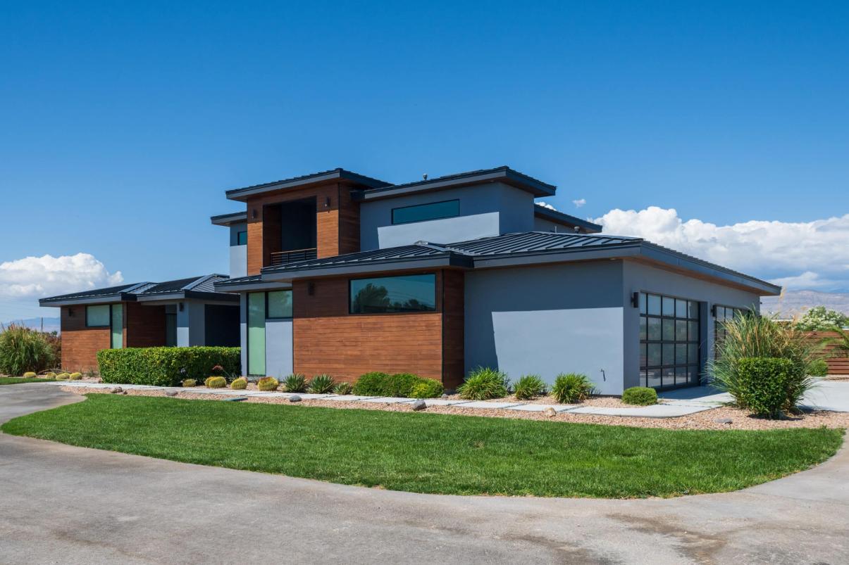 A modern home designed with wood, stone, and glass accents.