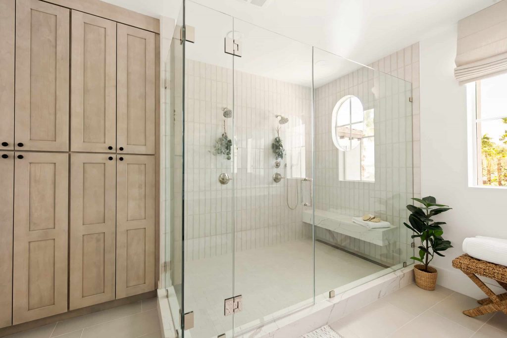 A luxury bathroom with a glass shower.