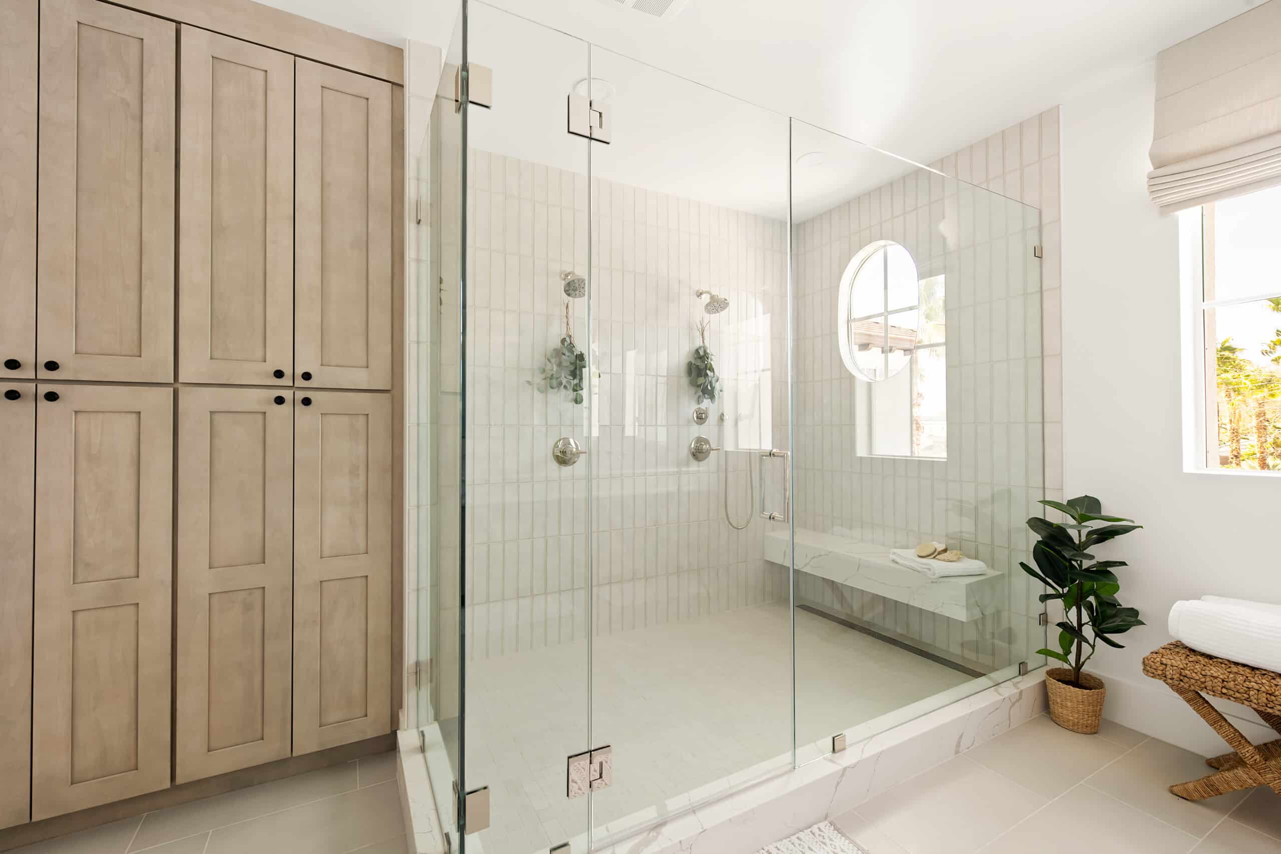 A luxury bathroom with a glass shower.