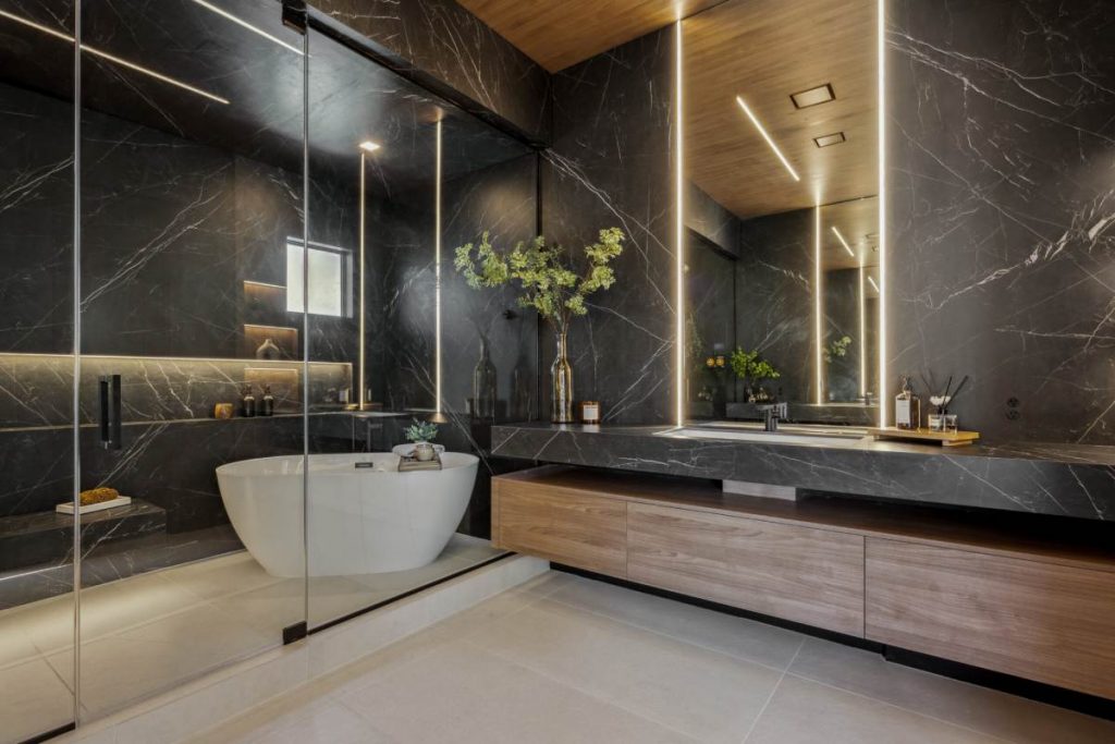 A luxury marble bathroom with a freestanding tub