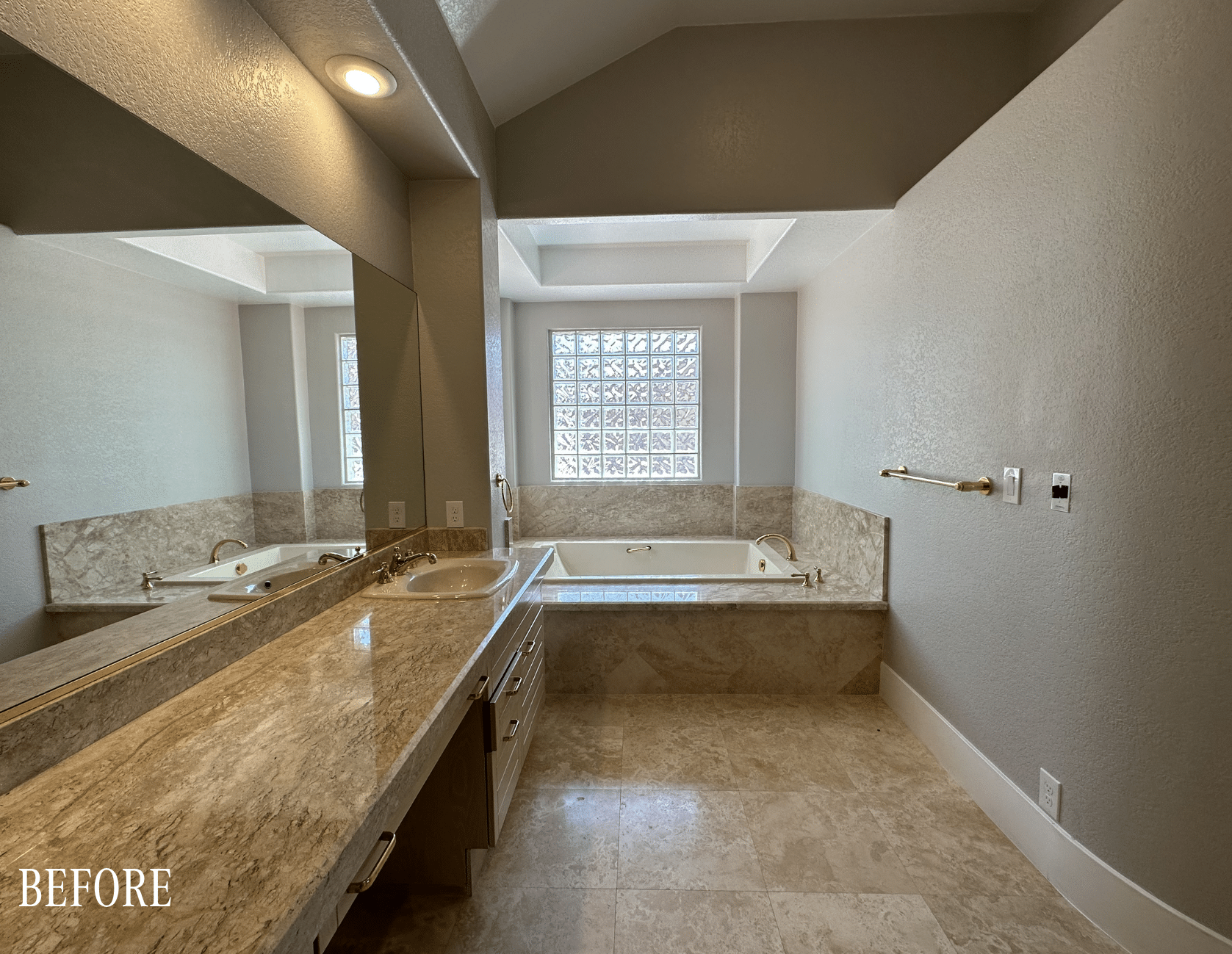 Before: Original primary bathroom before The Parker full home remodel Las Vegas