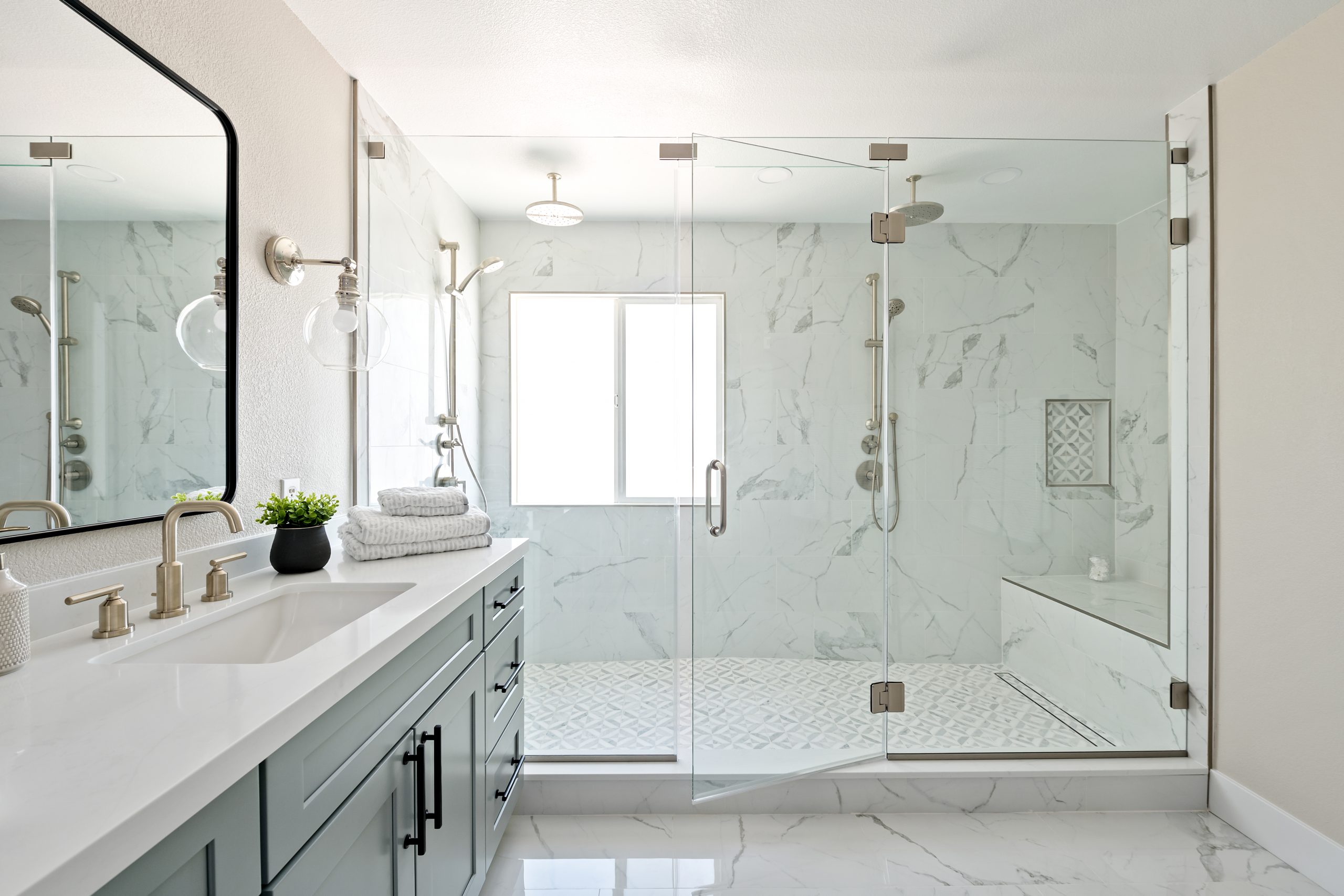Centennial Hills bathroom after remodel by Kingdom & Co., walk-in shower and fixtures