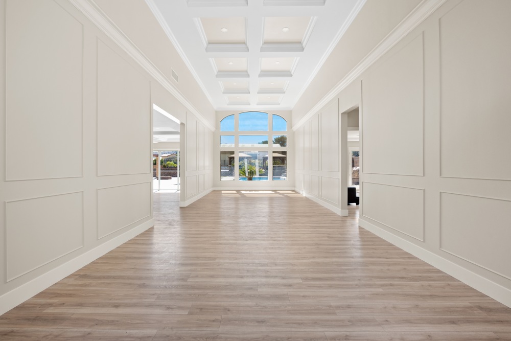 A large open hallway leading to a large window