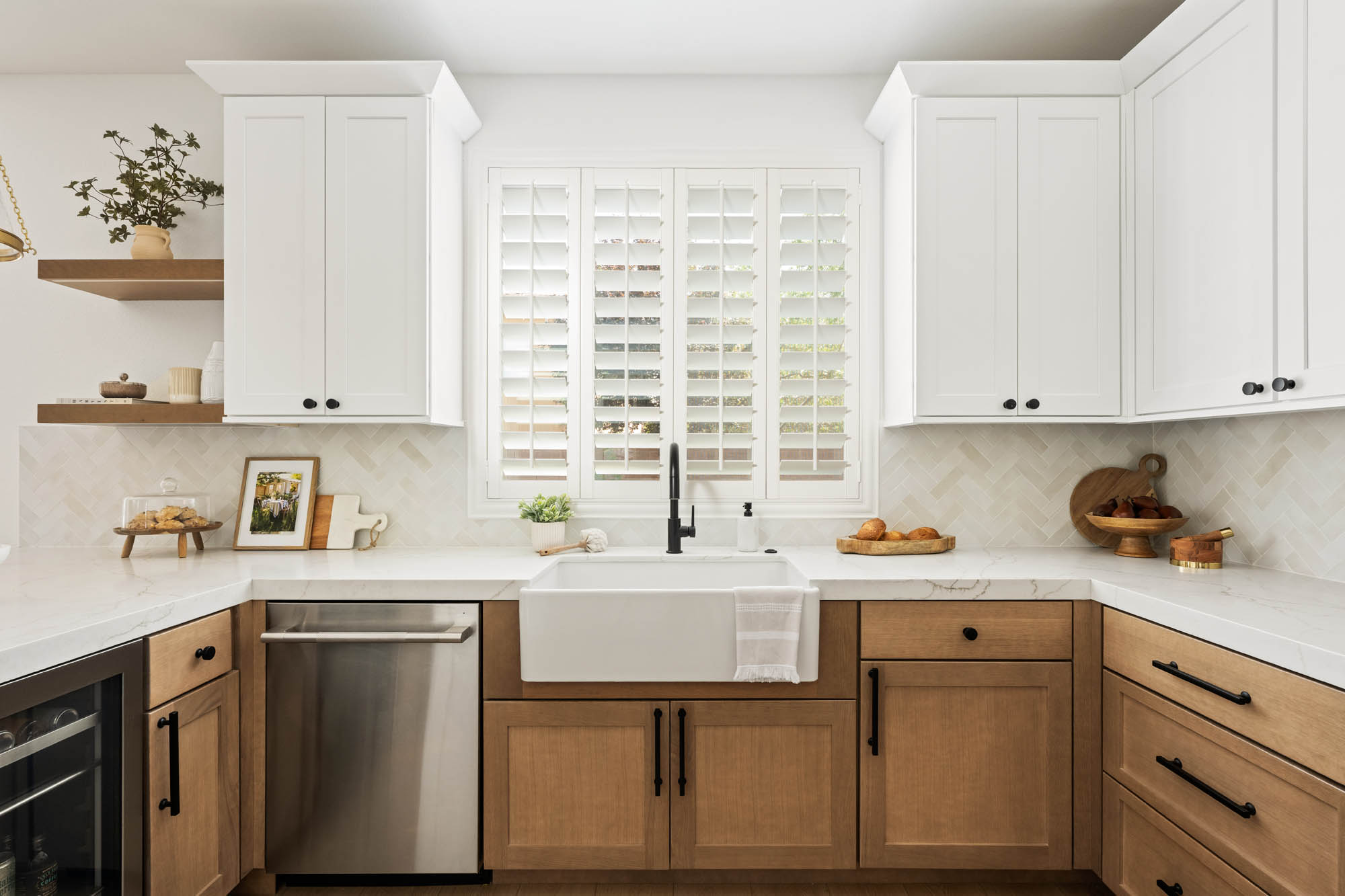 The Haven_12 Skye Canyon kitchen remodel after by K&Co., white farmhouse apron sink, black faucet and plantation shutters