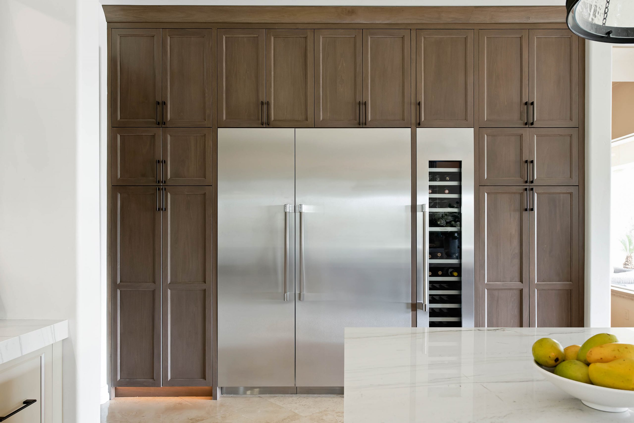The Volere_13 Centennial Hills kitchen after Small Luxuries remodel by Kingdom & Co., expanded layout, new cabinetry, and custom island