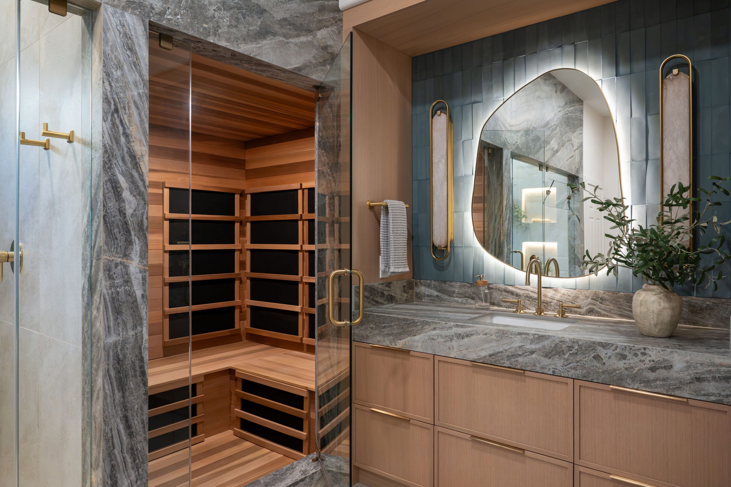 Cedar infrared sauna beside white oak vanity in primary spa suite, Kingdom & Co. Summerlin remodel.