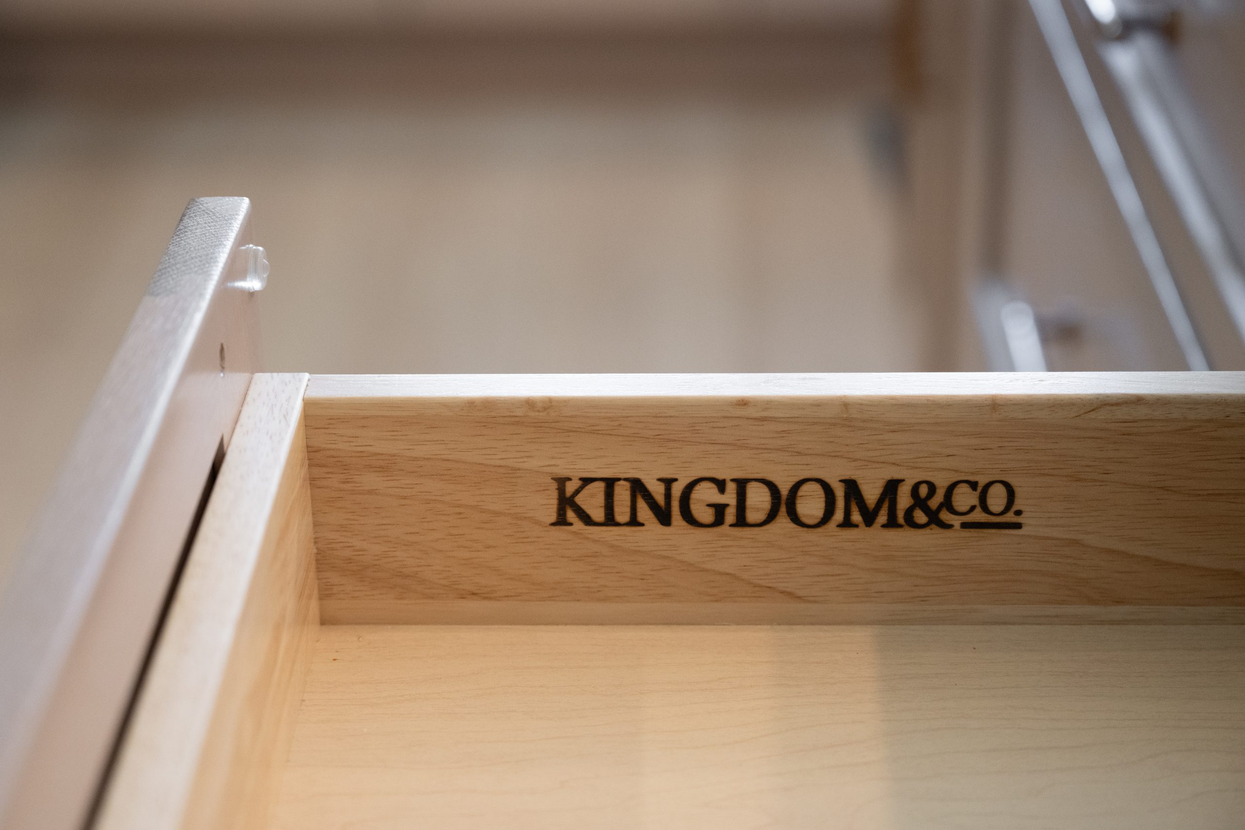 Kingdom & Co. brand mark burned into custom drawer interior at The Hearthstone kitchen in The Lakes.