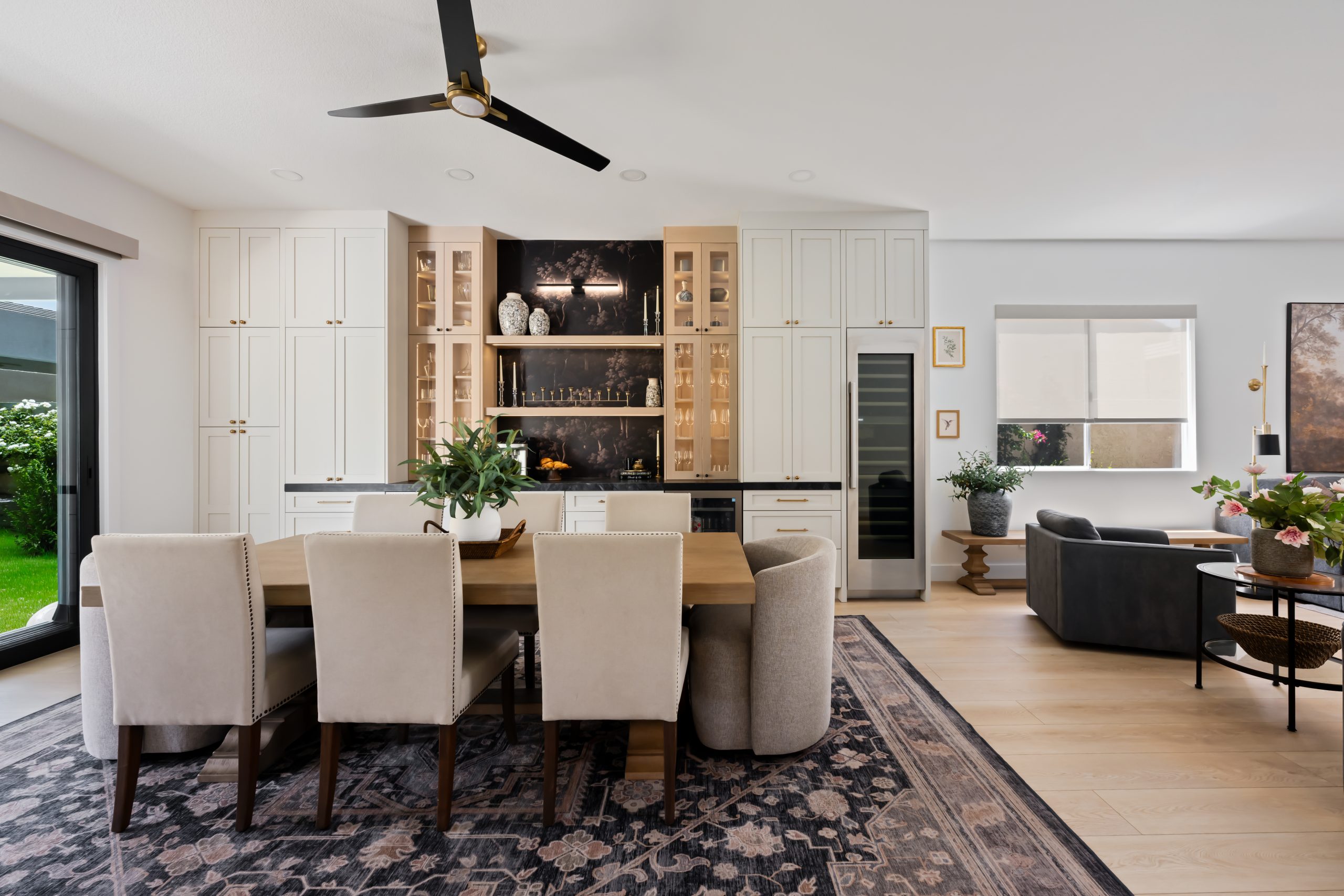 Open-concept dining room with kitchen and dry bar beyond, The Hearthstone remodel in The Lakes by Kingdom & Co.