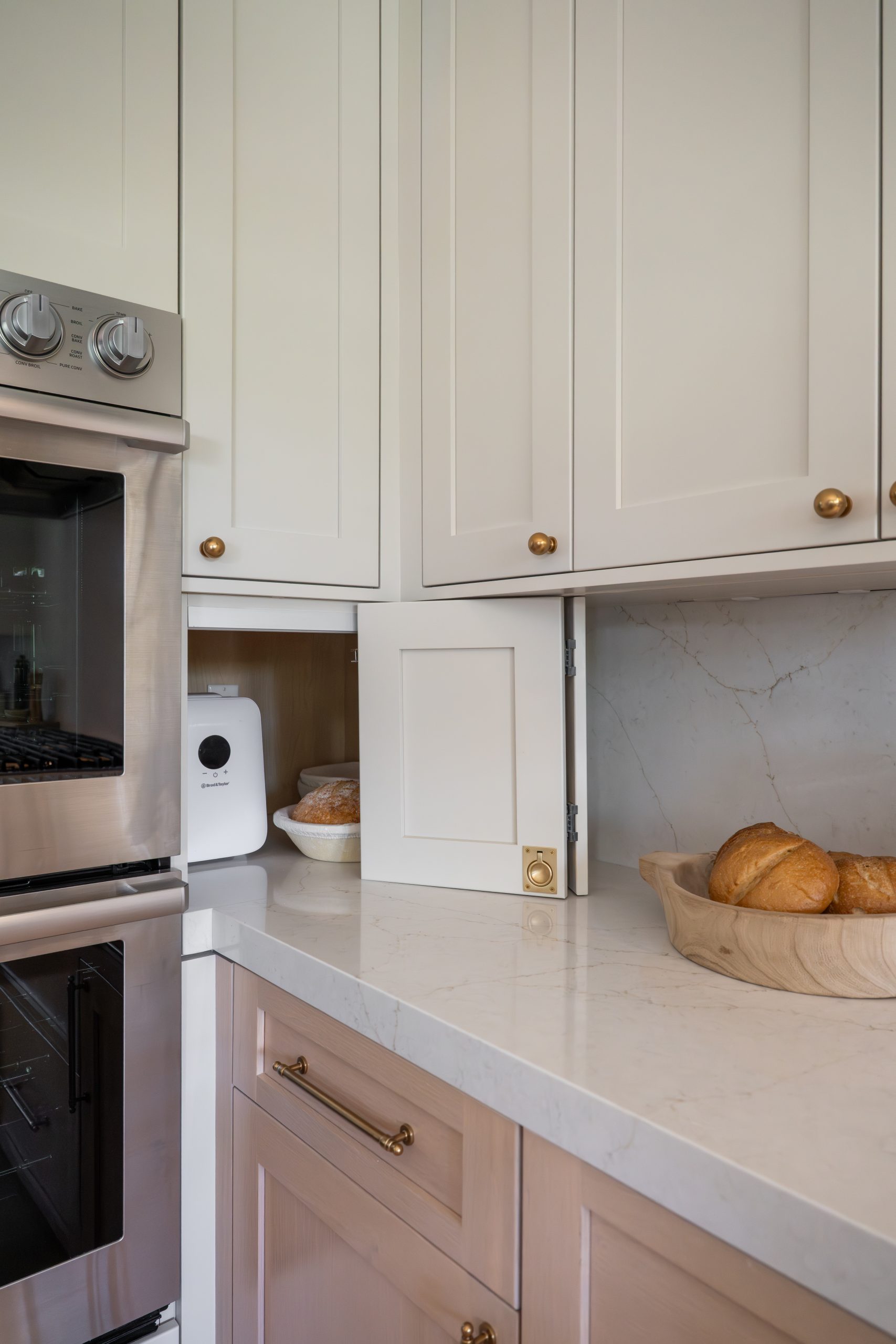 Sourdough proofing box hidden in appliance garage next to Wolf ovens, The Hearthstone kitchen by Kingdom & Co.
