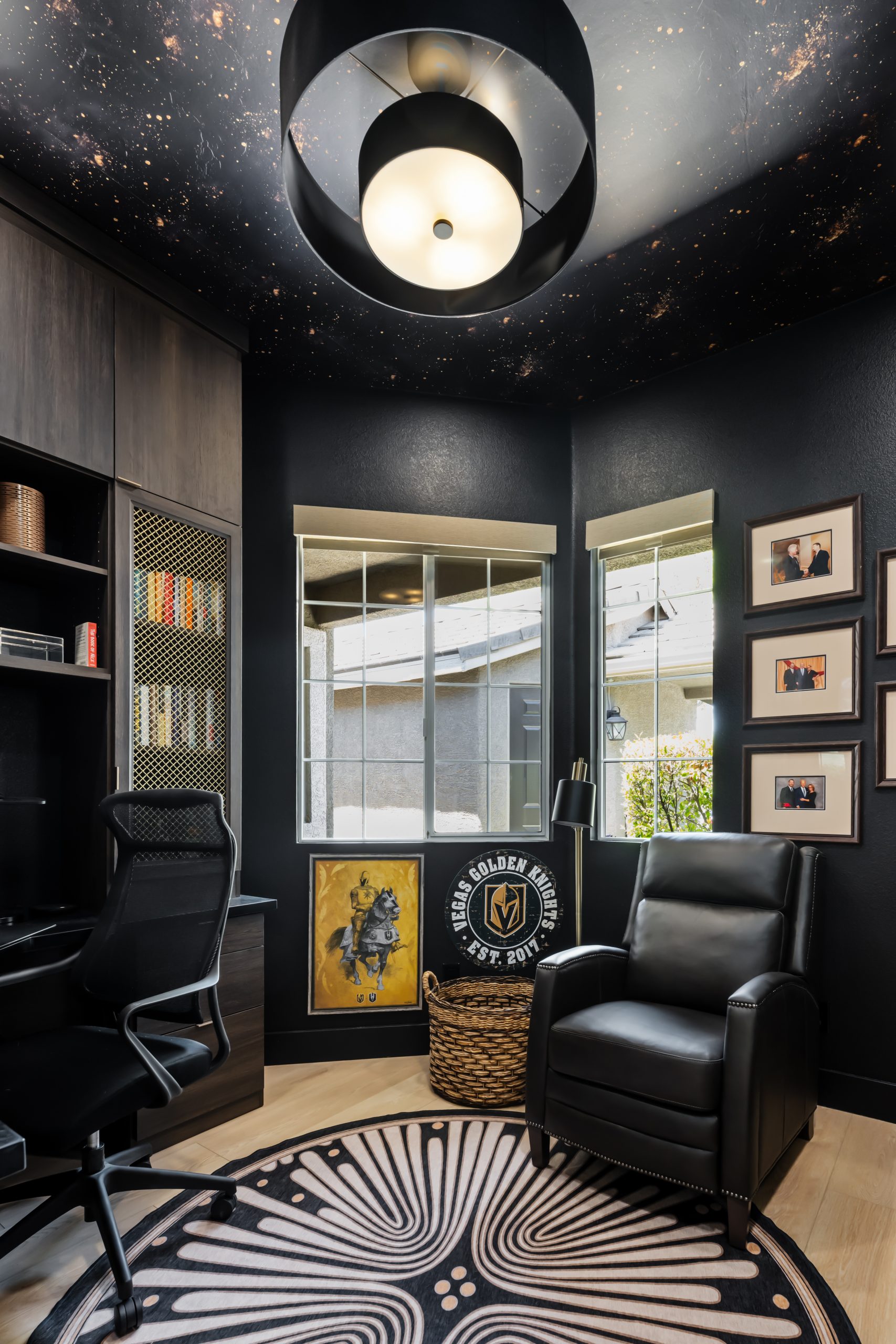 Moody home study with cosmic ceiling wallpaper and Vegas Golden Knights art, Kingdom & Co. The Lakes remodel.