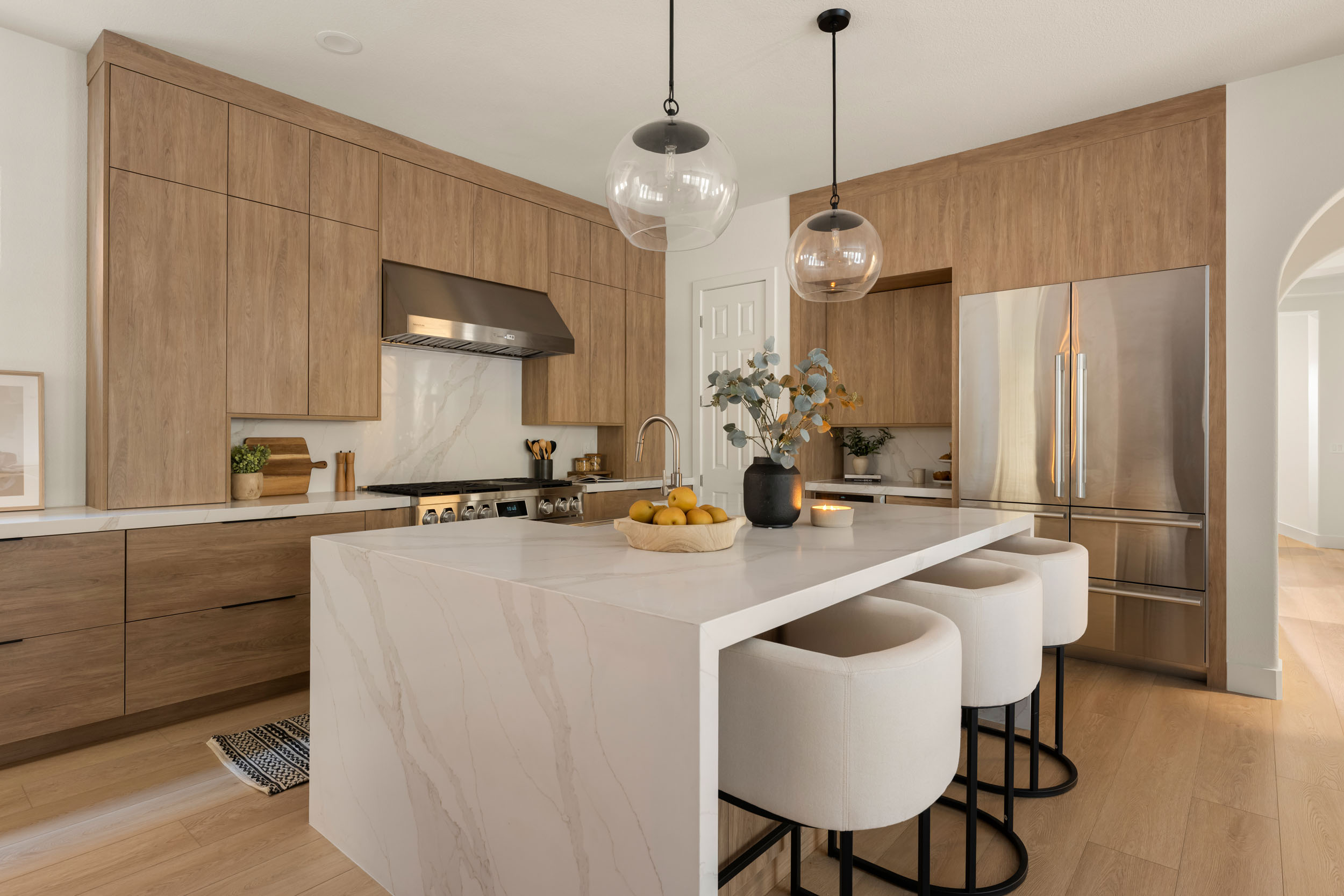 The_Elysian_SummerlinRemodel_Kingdom19 Modern kitchen with wood and marble.